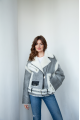 A stylish short leather jacket made of natural light gray sheepskin with white fur