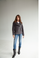 Short women's sheepskin coat made of ash-gray wool