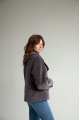 Short women's sheepskin coat made of ash-gray wool