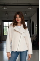 Short women's sheepskin coat made of milk-colored wool