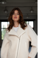 Short women's sheepskin coat made of milk-colored wool