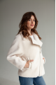 Short women's sheepskin coat made of milk-colored wool