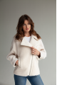 Short women's sheepskin coat made of milk-colored wool