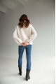 Short women's sheepskin coat made of milk-colored wool