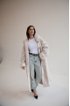 Long women's sheepskin-coat of white color made of natural sheepskin