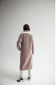 Women's coat of ash-pink color made of ECO fur