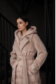 Cream-colored women's down jacket-coat with natural filling and sheep's wool