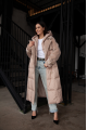 Cream-colored women's down jacket-coat with natural filling and sheep's wool