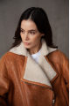 Women's sheepskin coat in whiskey color made of natural sheepskin in VINTAGE style