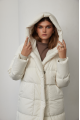 White women's down jacket of beige color with natural filling