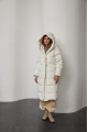 White women's down jacket of beige color with natural filling