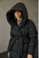 Women's long down jacket of black color with natural filling