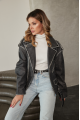 Women's stylish jacket of gray color in VINTAGE style made of genuine leather