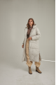 Women's long down jacket of white color with natural filler