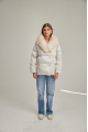 Women's down jacket of white color with fox fur and natural filler