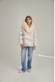 Women's down jacket of white color with fox fur and natural filler