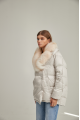 Women's down jacket of white color with fox fur and natural filler