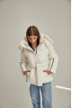 Short women's down jacket of milk color with natural filler