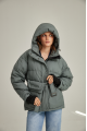 Women's short down jacket of green color with natural filler