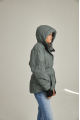 Women's short down jacket of green color with natural filler