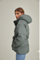 Women's short down jacket of green color with natural filler