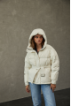 Women's down jacket of milk color with natural filler