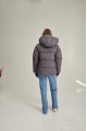 Women's short down jacket of gray color