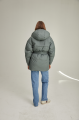 Women's down jacket of green color