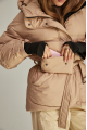 A short caramel-colored down jacket with natural filling