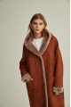 Women's long sheepskin coat of red color made of natural sheepskin