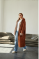 Women's long sheepskin coat of red color made of natural sheepskin