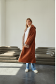 Women's long sheepskin coat of red color made of natural sheepskin