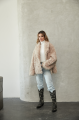 Women's double-sided sheepskin jacket of beige color made of natural sheepskin