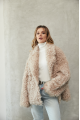 Women's double-sided sheepskin jacket of beige color made of natural sheepskin