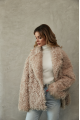 Women's double-sided sheepskin jacket of beige color made of natural sheepskin