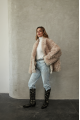 Women's double-sided sheepskin jacket of beige color made of natural sheepskin