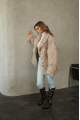 Women's double-sided sheepskin jacket of beige color made of natural sheepskin