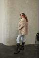 Women's double-sided sheepskin jacket of beige color made of natural sheepskin