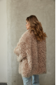 Women's double-sided sheepskin jacket of beige color made of natural sheepskin