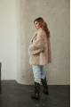 Women's double-sided sheepskin jacket of beige color made of natural sheepskin