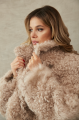 Women's double-sided sheepskin jacket of beige color made of natural sheepskin