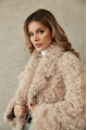 Women's double-sided sheepskin jacket of beige color made of natural sheepskin