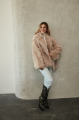 Women's double-sided sheepskin jacket of beige color made of natural sheepskin