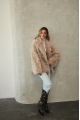 Women's double-sided sheepskin jacket of beige color made of natural sheepskin