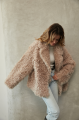 Women's double-sided sheepskin jacket of beige color made of natural sheepskin