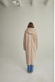 Women's long sheepskin coat of beige color made of natural sheepskin