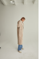 Women's long sheepskin coat of beige color made of natural sheepskin