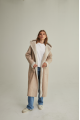 Women's long sheepskin coat of beige color made of natural sheepskin