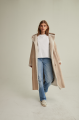 Women's long sheepskin coat of beige color made of natural sheepskin