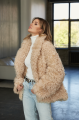 Women's two-sided sheepskin jacket made of natural sheepskin in beige color